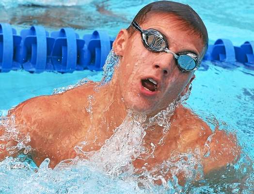 Towamencin swimmer Nico Kountroubis makes his turn competing in a Boys 15 and Over 100 yard breaststroke event during the Bux-Mont “A” Swimming Championships at the Towamencin Community Pool -- Mark C Psoras