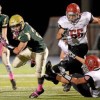 Lansdale Catholic’s Ryan Quigley spins away from Archbishop Carroll’s Harry Rohlfing during their game on Friday, Oct. 23, 2015. (Bob Raines/Montgomery Media)