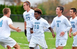 North Penn goalscorer Liam Parker (10) celebrates with teammates (from left) Noah Kwortnik, Colin Jerome (17) Eric Rosenblatt (6) and Nate Baxter after his goal against Strath Haven during first-half action of their contest at North Penn High School on Tuesday, Oct. 27, 2015. (Mark C Psoras/The Reporter)